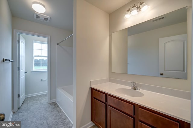 bathroom with tile floors, shower / bathing tub combination, and vanity