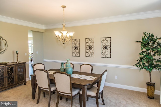 dining space featuring light carpet, a chandelier, and crown molding