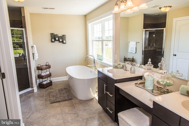 bathroom with independent shower and bath, tile flooring, and vanity