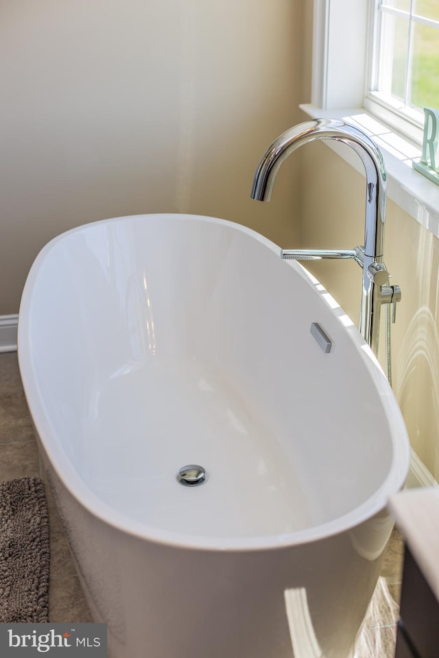 details featuring tile flooring and sink