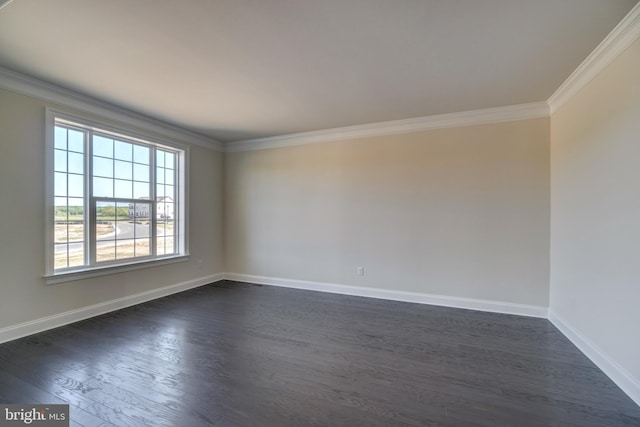 empty room with crown molding, dark hardwood / wood-style floors, and a healthy amount of sunlight