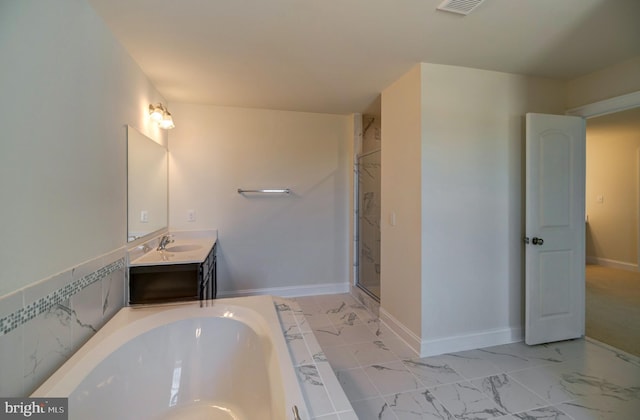 bathroom with tile floors, double sink vanity, and independent shower and bath