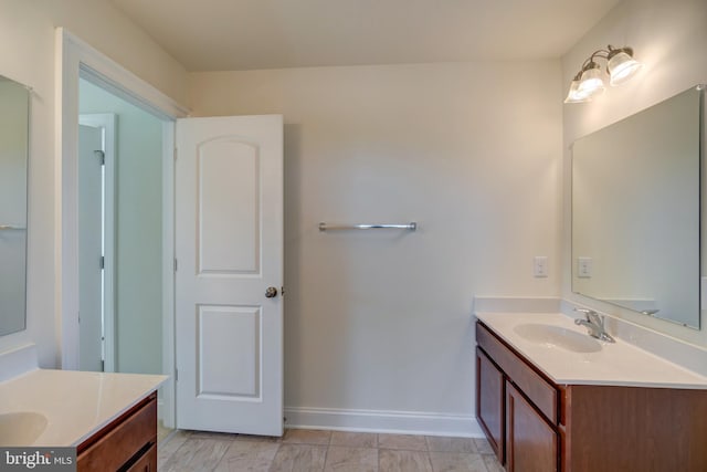 bathroom featuring tile floors and vanity