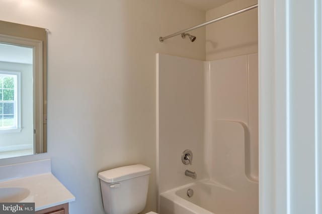 full bathroom featuring bathing tub / shower combination, toilet, and vanity