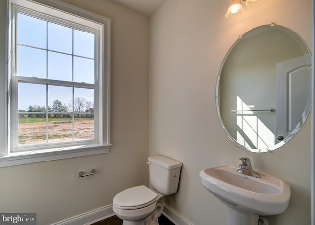 bathroom featuring toilet and sink