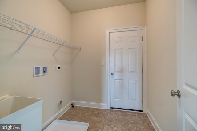 laundry area with sink, electric dryer hookup, tile floors, and hookup for a washing machine