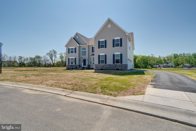 view of front facade with a front lawn