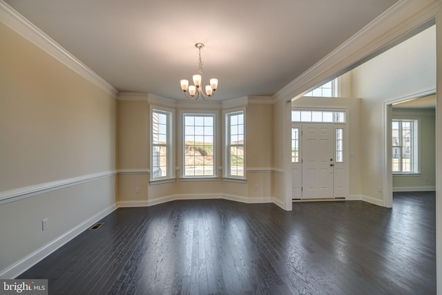 interior space featuring crown molding, dark hardwood / wood-style floors, and an inviting chandelier