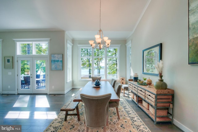 dining room featuring an inviting chandelier, plenty of natural light, dark wood-type flooring, and french doors