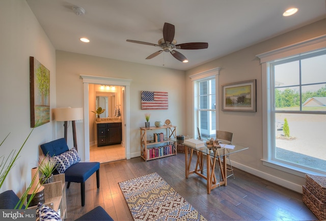 office area with dark hardwood / wood-style floors and ceiling fan