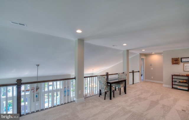 sitting room featuring lofted ceiling, light colored carpet, and ceiling fan