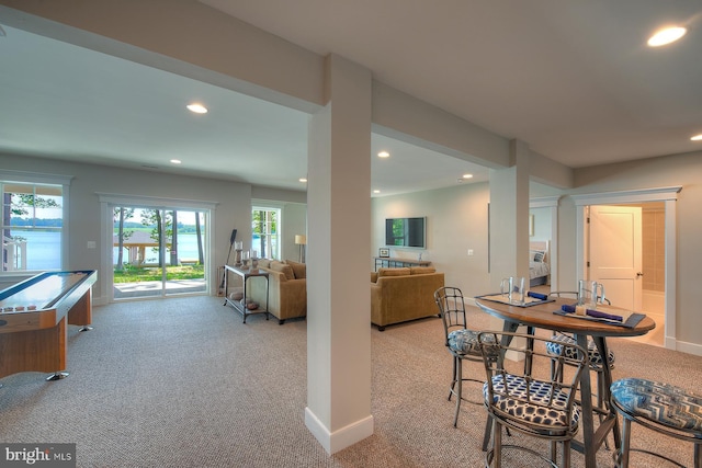 dining room with light colored carpet