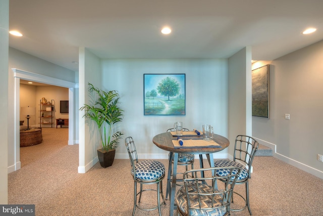 view of carpeted dining area