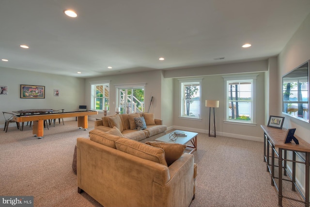 living room with light carpet and plenty of natural light