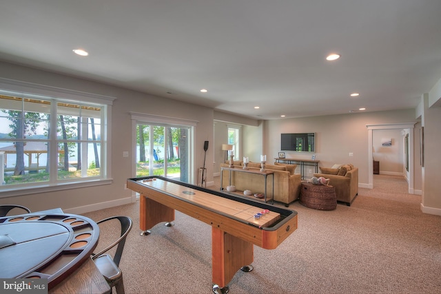 game room featuring light carpet