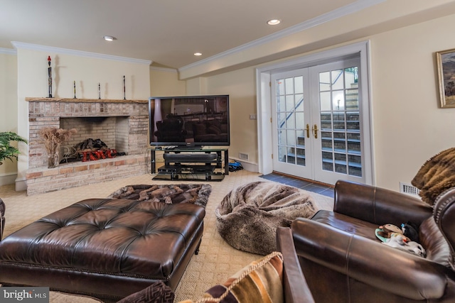 carpeted living room with french doors, a brick fireplace, and ornamental molding