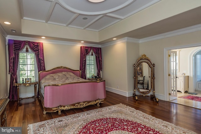 bedroom with ensuite bath, coffered ceiling, and dark wood-type flooring