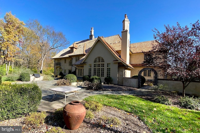 rear view of house featuring a patio area