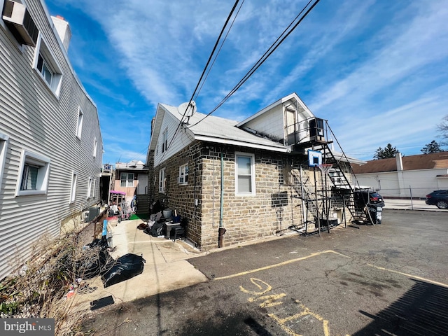 view of home's exterior with central AC unit