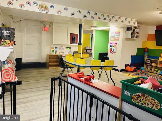 playroom with light hardwood / wood-style floors