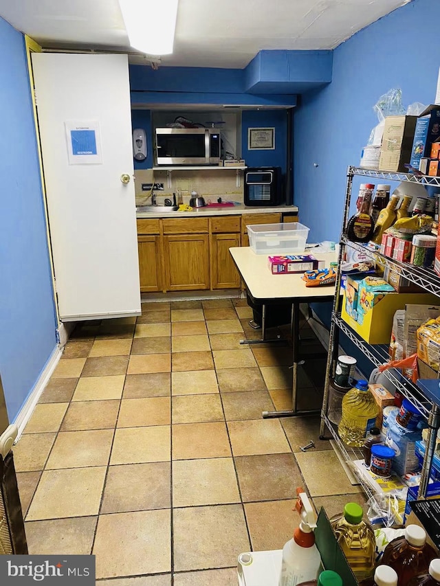 kitchen with light tile floors