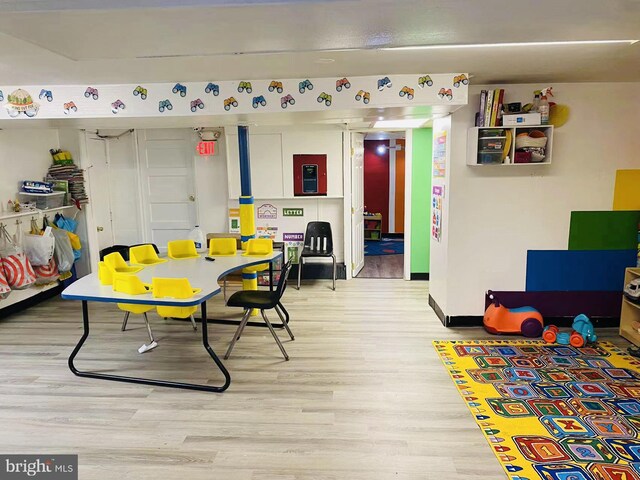 playroom with light hardwood / wood-style floors