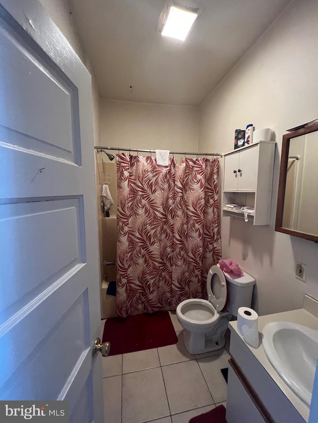 full bathroom with toilet, shower / tub combo, tile floors, and vanity