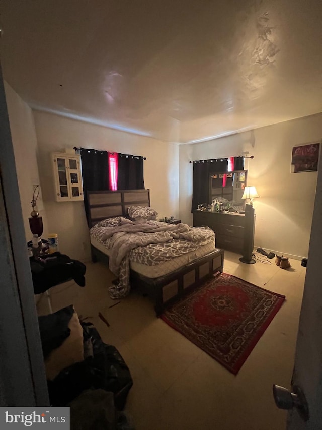 bedroom with light tile floors