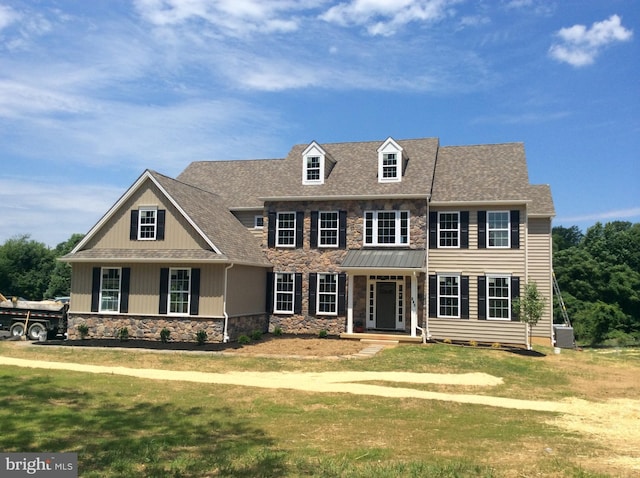 colonial inspired home with a front yard