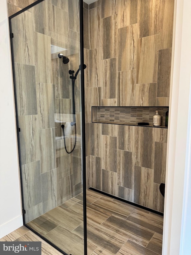 bathroom with tiled shower