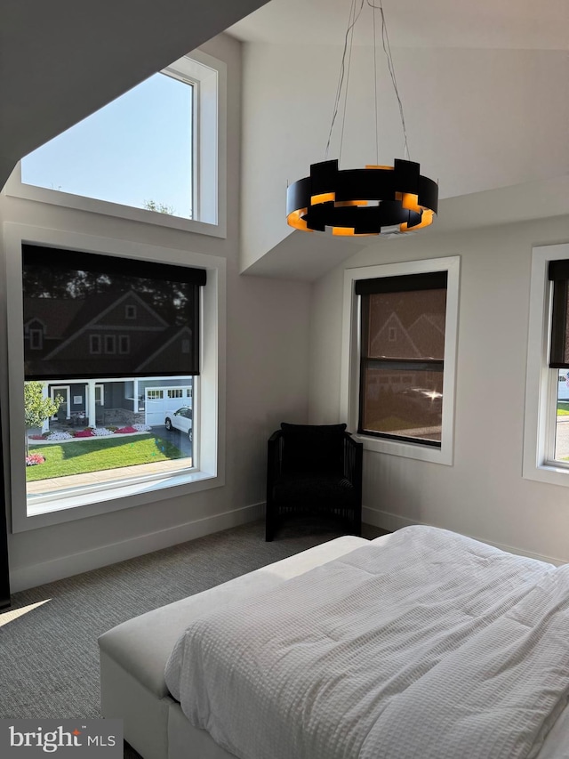 bedroom with carpet flooring and baseboards