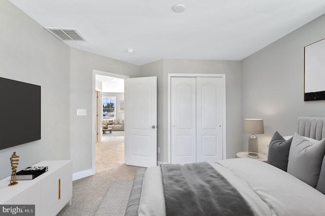 carpeted bedroom featuring a closet