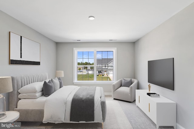 bedroom with light colored carpet