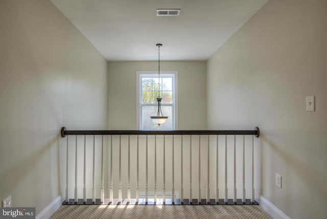 staircase featuring carpet flooring