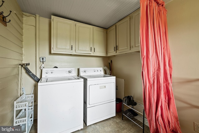 clothes washing area featuring washer hookup, separate washer and dryer, cabinets, and light tile flooring