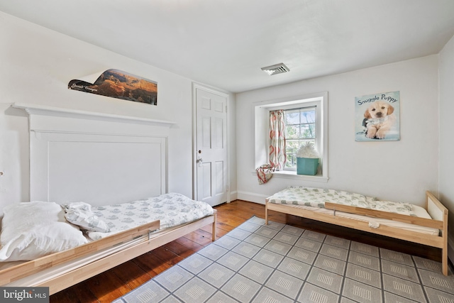 bedroom with light hardwood / wood-style flooring