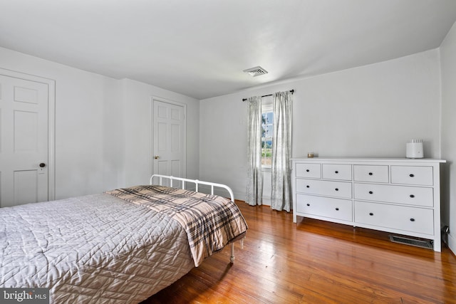 bedroom featuring wood-type flooring