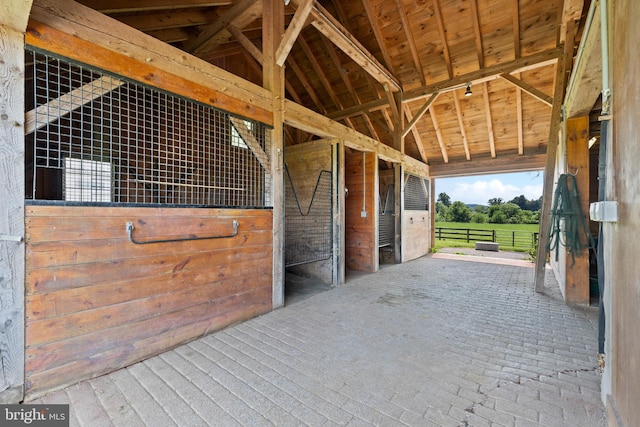 view of horse barn with an outdoor structure