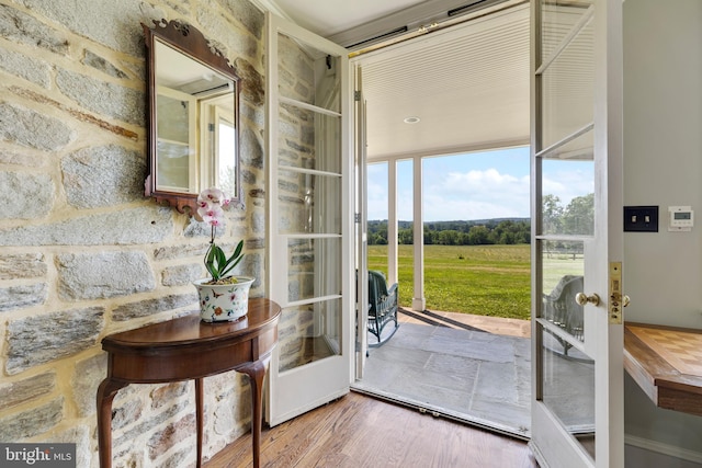 doorway featuring french doors and wood-type flooring