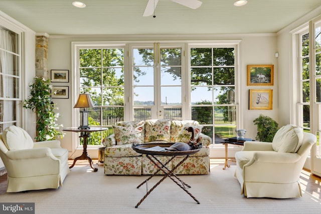 sunroom with ceiling fan