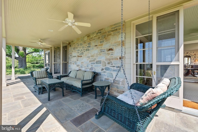 view of terrace with an outdoor hangout area and ceiling fan