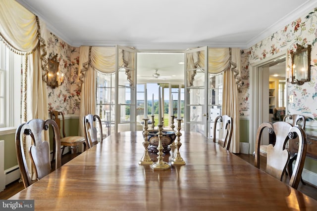 dining area with ceiling fan, ornamental molding, dark hardwood / wood-style floors, and a baseboard heating unit