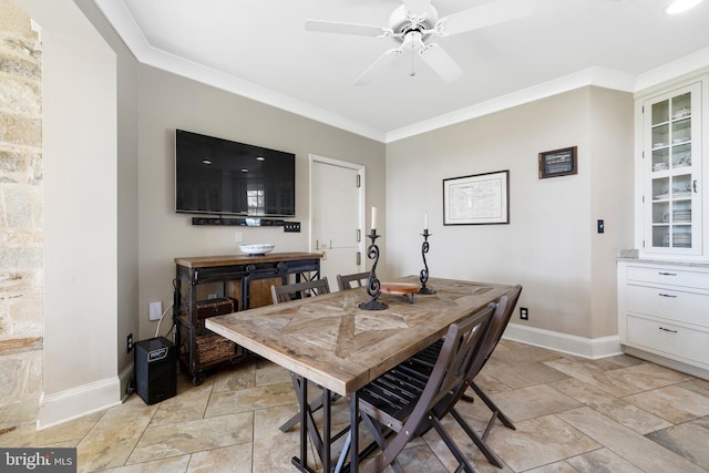 dining area with crown molding, ceiling fan, and light tile floors