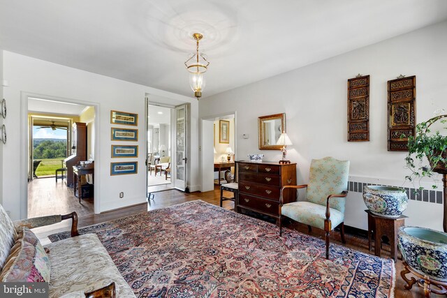 sitting room with dark hardwood / wood-style floors