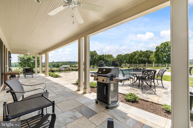 view of patio with a grill and ceiling fan