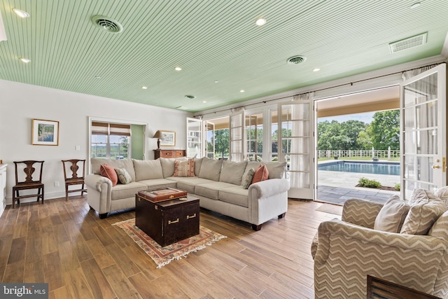 living room featuring french doors and hardwood / wood-style flooring