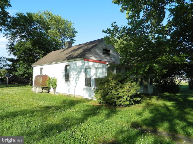 view of home's exterior featuring a yard