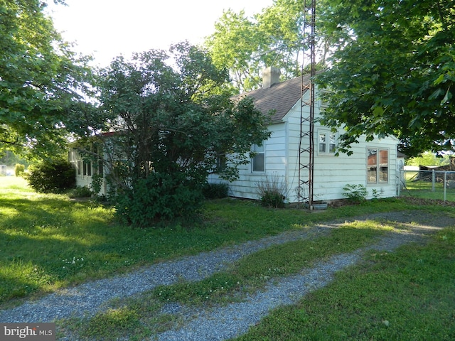 view of property exterior featuring a yard