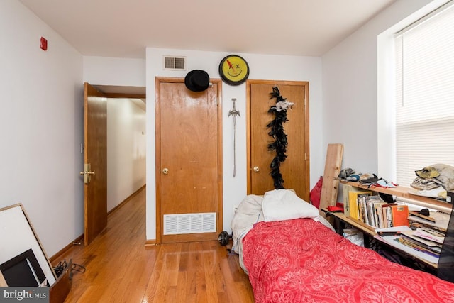 bedroom featuring light wood-type flooring