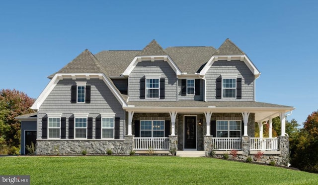 view of front of house featuring a front yard and covered porch